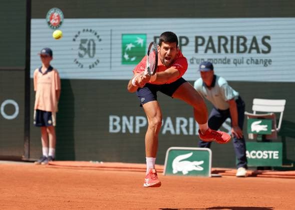 Serbian Novak Djokovic returns the ball to Aleksandar Kovacevic of the US during their first-round match at Roland Garros French Tennis Open in Paris, France, on Monday, May 29, 2023. Djokovic won 6-3, 6-2, 7-6.  PAR20230529516 MAYAxVIDON-WHITE