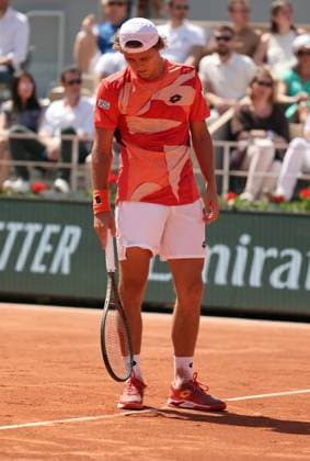 Aleksandar Kovacevic of the US checks a mark on the court during his first-round match against Serbian Novak Djokovic at Roland Garros French Tennis Open in Paris, France, on Monday, May 29, 2023. Djokovic won 6-3, 6-2, 7-6.  PAR20230529525 MAYAxVIDON-WHITE