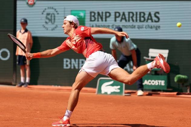 Aleksandar Kovacevic of the US returns the ball to Serbian Novak Djokovic during their first-round match at Roland Garros French Tennis Open in Paris, France, on Monday, May 29, 2023. Djokovic won 6-3, 6-2, 7-6.  PAR20230529529 MAYAxVIDON-WHITE