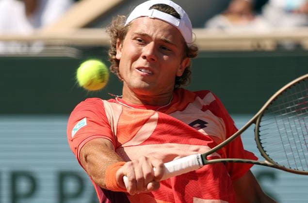 Aleksandar Kovacevic of the US returns the ball to Serbian Novak Djokovic during their first-round match at Roland Garros French Tennis Open in Paris, France, on Monday, May 29, 2023. Djokovic won 6-3, 6-2, 7-6.  PAR20230529530 MAYAxVIDON-WHITE