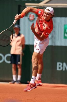 Aleksandar Kovacevic of the US serves to Serbian Novak Djokovic during their first-round match at Roland Garros French Tennis Open in Paris, France, on Monday, May 29, 2023. Djokovic won 6-3, 6-2, 7-6.  PAR20230529523 MAYAxVIDON-WHITE