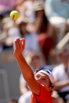 Aleksandar Kovacevic of the US serves to Serbian Novak Djokovic during their first-round match at Roland Garros French Tennis Open in Paris, France, on Monday, May 29, 2023. Djokovic won 6-3, 6-2, 7-6.  PAR20230529526 MAYAxVIDON-WHITE