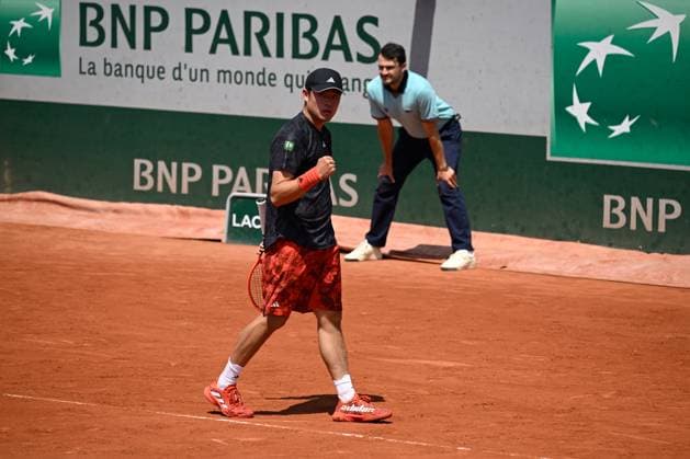 (230530) -- PARIS, May 30, 2023 -- Wu Yibing of China celebrates during the men s singles first round match against Roberto Bautista Agut of Spain at the French Open tennis tournament at Roland Garros in Paris, France, May 29, 2023. (Photo by Xinhua) (SP)FRANCE-PARIS-TENNIS-ROLAND GARROS-FRENCH OPEN-MEN S SINGLES JulienxMattia 