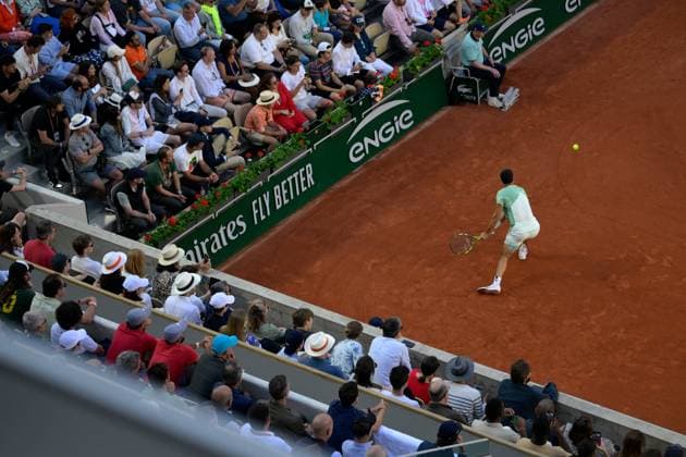 (230530) -- PARIS, May 30, 2023 -- Carlos Alcaraz of Spain returns the ball during the men s singles first round match between Carlos Alcaraz of Spain and Flavio Cobolli of Italy at the French Open tennis tournament at Roland Garros in Paris, France, on May 29, 2023. (Photo by Xinhua) (SP)FRANCE-PARIS-TENNIS-ROLAND GARROS-FRENCH OPEN-MEN S SINGLES JulienxMattia 