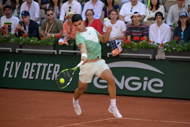 (230530) -- PARIS, May 30, 2023 -- Carlos Alcaraz of Spain returns the ball during the men s singles first round match between Carlos Alcaraz of Spain and Flavio Cobolli of Italy at the French Open tennis tournament at Roland Garros in Paris, France, on May 29, 2023. (Photo by Xinhua) (SP)FRANCE-PARIS-TENNIS-ROLAND GARROS-FRENCH OPEN-MEN S SINGLES JulienxMattia 