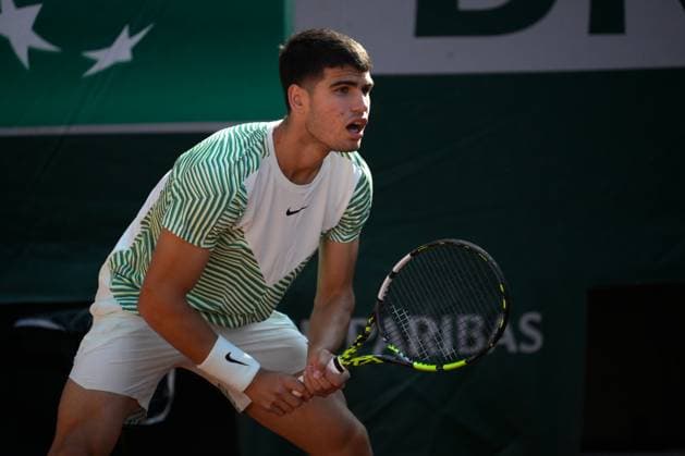 (230530) -- PARIS, May 30, 2023 -- Carlos Alcaraz of Spain reacts during the men s singles first round match between Carlos Alcaraz of Spain and Flavio Cobolli of Italy at the French Open tennis tournament at Roland Garros in Paris, France, on May 29, 2023. (Photo by Xinhua) (SP)FRANCE-PARIS-TENNIS-ROLAND GARROS-FRENCH OPEN-MEN S SINGLES JulienxMattia 