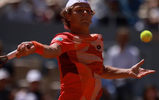 (230530) -- PARIS, May 30, 2023 -- Aleksandar Kovacevic of the United States returns the ball during the men s singles first round match between Novak Djokovic of Serbia and Aleksandar Kovacevic of the United States at the French Open tennis tournament at Roland Garros in Paris, France, on May 29, 2023. ) (SP)FRANCE-PARIS-TENNIS-ROLAND GARROS-FRENCH OPEN-MEN S SINGLES GaoxJing 