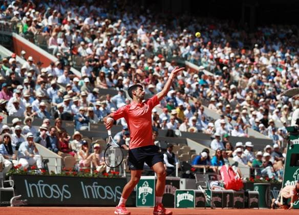 (230530) -- PARIS, May 30, 2023 -- Novak Djokovic of Serbia serves during the men s singles first round match between Novak Djokovic of Serbia and Aleksandar Kovacevic of the United States at the French Open tennis tournament at Roland Garros in Paris, France, on May 29, 2023. ) (SP)FRANCE-PARIS-TENNIS-ROLAND GARROS-FRENCH OPEN-MEN S SINGLES GaoxJing 