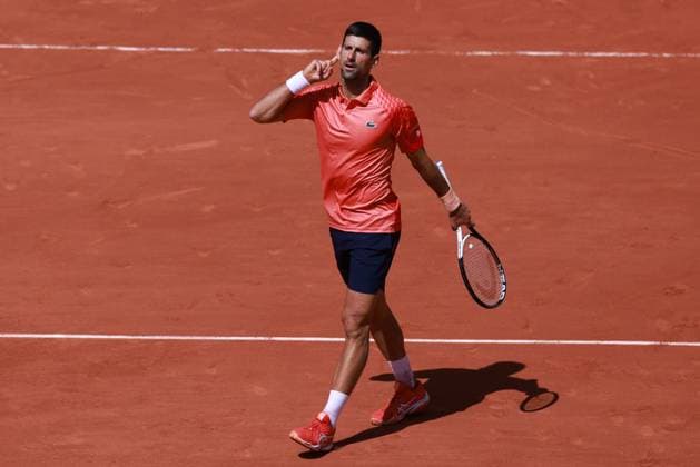 (230530) -- PARIS, May 30, 2023 -- Novak Djokovic of Serbia reacts during the men s singles first round match between Novak Djokovic of Serbia and Aleksandar Kovacevic of the United States at the French Open tennis tournament at Roland Garros in Paris, France, on May 29, 2023. ) (SP)FRANCE-PARIS-TENNIS-ROLAND GARROS-FRENCH OPEN-MEN S SINGLES GaoxJing 