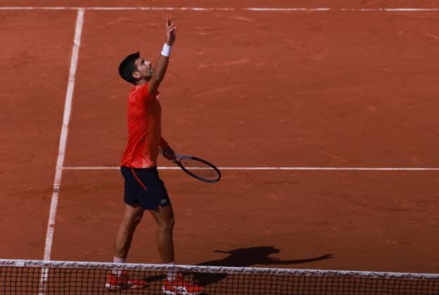 (230530) -- PARIS, May 30, 2023 -- Novak Djokovic of Serbia celebrates his victory after the men s singles first round match between Novak Djokovic of Serbia and Aleksandar Kovacevic of the United States at the French Open tennis tournament at Roland Garros in Paris, France, on May 29, 2023. ) (SP)FRANCE-PARIS-TENNIS-ROLAND GARROS-FRENCH OPEN-MEN S SINGLES GaoxJing 