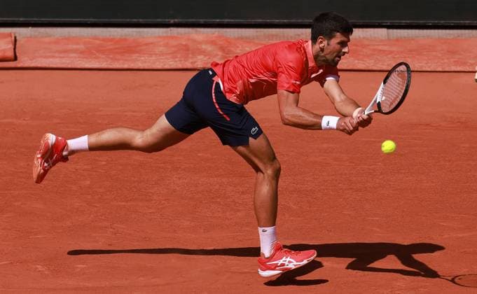 (230530) -- PARIS, May 30, 2023 -- Novak Djokovic of Serbia returns the ball during the men s singles first round match between Novak Djokovic of Serbia and Aleksandar Kovacevic of the United States at the French Open tennis tournament at Roland Garros in Paris, France, on May 29, 2023. ) (SP)FRANCE-PARIS-TENNIS-ROLAND GARROS-FRENCH OPEN-MEN S SINGLES GaoxJing 