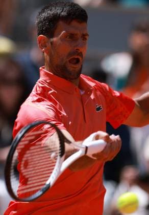 (230530) -- PARIS, May 30, 2023 -- Novak Djokovic of Serbia returns the ball during the men s singles first round match between Novak Djokovic of Serbia and Aleksandar Kovacevic of the United States at the French Open tennis tournament at Roland Garros in Paris, France, on May 29, 2023. ) (SP)FRANCE-PARIS-TENNIS-ROLAND GARROS-FRENCH OPEN-MEN S SINGLES GaoxJing 
