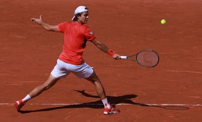 (230530) -- PARIS, May 30, 2023 -- Aleksandar Kovacevic of the United States returns the ball during the men s singles first round match between Novak Djokovic of Serbia and Aleksandar Kovacevic of the United States at the French Open tennis tournament at Roland Garros in Paris, France, on May 29, 2023. ) (SP)FRANCE-PARIS-TENNIS-ROLAND GARROS-FRENCH OPEN-MEN S SINGLES GaoxJing 