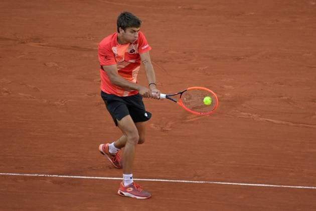 (230530) -- PARIS, May 30, 2023 -- Flavio Cobolli of Italy returns the ball during the men s singles first round match between Carlos Alcaraz of Spain and Flavio Cobolli of Italy at the French Open tennis tournament at Roland Garros in Paris, France, on May 29, 2023. (Photo by Xinhua) (SP)FRANCE-PARIS-TENNIS-ROLAND GARROS-FRENCH OPEN-MEN S SINGLES JulienxMattia 