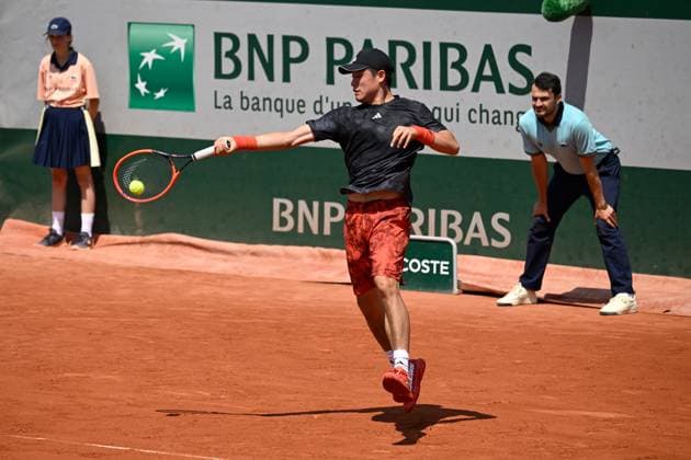 (230530) -- PARIS, May 30, 2023 -- Wu Yibing of China hits a return during the men s singles first round match against Roberto Bautista Agut of Spain at the French Open tennis tournament at Roland Garros in Paris, France, May 29, 2023. (Photo by Xinhua) (SP)FRANCE-PARIS-TENNIS-ROLAND GARROS-FRENCH OPEN-MEN S SINGLES JulienxMattia 