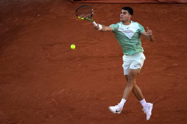 (230530) -- PARIS, May 30, 2023 -- Carlos Alcaraz of Spain returns the ball during the men s singles first round match between Carlos Alcaraz of Spain and Flavio Cobolli of Italy at the French Open tennis tournament at Roland Garros in Paris, France, on May 29, 2023. (Photo by Xinhua) (SP)FRANCE-PARIS-TENNIS-ROLAND GARROS-FRENCH OPEN-MEN S SINGLES JulienxMattia 
