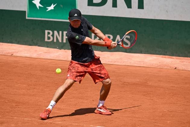 (230530) -- PARIS, May 30, 2023 -- Wu Yibing of China hits a return during the men s singles first round match against Roberto Bautista Agut of Spain at the French Open tennis tournament at Roland Garros in Paris, France, May 29, 2023. (Photo by Xinhua) (SP)FRANCE-PARIS-TENNIS-ROLAND GARROS-FRENCH OPEN-MEN S SINGLES JulienxMattia 