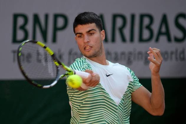 (230530) -- PARIS, May 30, 2023 -- Carlos Alcaraz of Spain returns the ball during the men s singles first round match between Carlos Alcaraz of Spain and Flavio Cobolli of Italy at the French Open tennis tournament at Roland Garros in Paris, France, on May 29, 2023. (Photo by Xinhua) (SP)FRANCE-PARIS-TENNIS-ROLAND GARROS-FRENCH OPEN-MEN S SINGLES JulienxMattia 