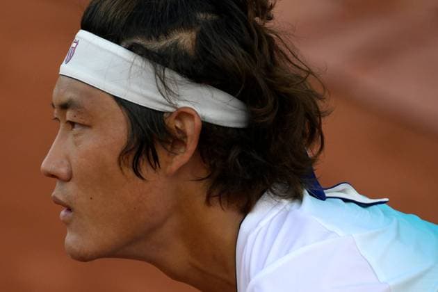 (230530) -- PARIS, May 30, 2023 -- Zhang Zhizhen of China reacts during the men s singles first round match against Susan Lajovic of Serbia at the French Open tennis tournament at Roland Garros in Paris, France, May 29, 2023. (Photo by Xinhua) (SP)FRANCE-PARIS-TENNIS-ROLAND GARROS-FRENCH OPEN-MEN S SINGLES JulienxMattia 