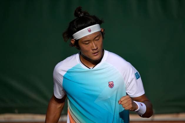 (230530) -- PARIS, May 30, 2023 -- Zhang Zhizhen of China celebrates during the men s singles first round match against Susan Lajovic of Serbia at the French Open tennis tournament at Roland Garros in Paris, France, May 29, 2023. (Photo by Xinhua) (SP)FRANCE-PARIS-TENNIS-ROLAND GARROS-FRENCH OPEN-MEN S SINGLES JulienxMattia 