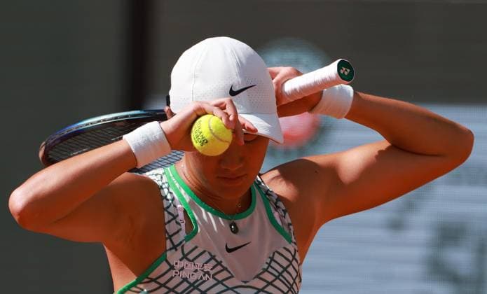 (230530) -- PARIS, May 30, 2023 -- Wang Xiyu of China reacts during the women s singles first round match between Wang Xiyu of China and Caroline Garcia of France at the French Open tennis tournament at Roland Garros in Paris, France, on May 29, 2023. ) (SP)FRANCE-PARIS-TENNIS-ROLAND GARROS-FRENCH OPEN-WOMEN S SINGLES GaoxJing 