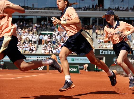 Ball kids run into position during world number 2 seeded Daniil Medvedev of Russia s first-round match against Thiago Seyboth Wild of Brazil at Roland Garros French Tennis Open in Paris, France, on Tuesday, May 30, 2023.  PAR20230530135 MAYAxVIDON-WHITE