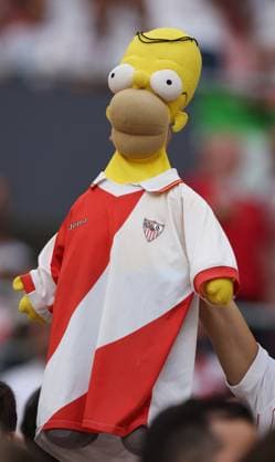 Budapest, Hungary, 31st May 2023. Sevilla fans with a Homer Simpson puppet in one of their shirts during the UEFA Europa League Final match at Puskas Arena, Budapest. Picture credit should read: David Klein Sportimage EDITORIAL USE ONLY. No use with unauthorised audio, video, data, fixture lists, club league logos or live services. Online in-match use limited to 120 images, no video emulation. No use in betting, games or single club league player publications. SPI-2471-0012
