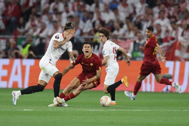 Budapest, Hungary, 31st May 2023. Paulo Dybala of AS Roma tackled by Nemanja Gudelj of Sevilla during the UEFA Europa League Final match at Puskas Arena, Budapest. Picture credit should read: David Klein Sportimage EDITORIAL USE ONLY. No use with unauthorised audio, video, data, fixture lists, club league logos or live services. Online in-match use limited to 120 images, no video emulation. No use in betting, games or single club league player publications. SPI-2471-0050
