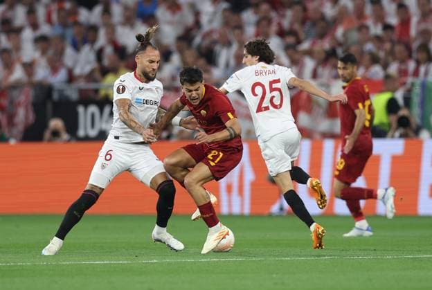Budapest, Hungary, 31st May 2023. Paulo Dybala of AS Roma tackled by Nemanja Gudelj of Sevilla during the UEFA Europa League Final match at Puskas Arena, Budapest. Picture credit should read: David Klein Sportimage EDITORIAL USE ONLY. No use with unauthorised audio, video, data, fixture lists, club league logos or live services. Online in-match use limited to 120 images, no video emulation. No use in betting, games or single club league player publications. SPI-2471-0051