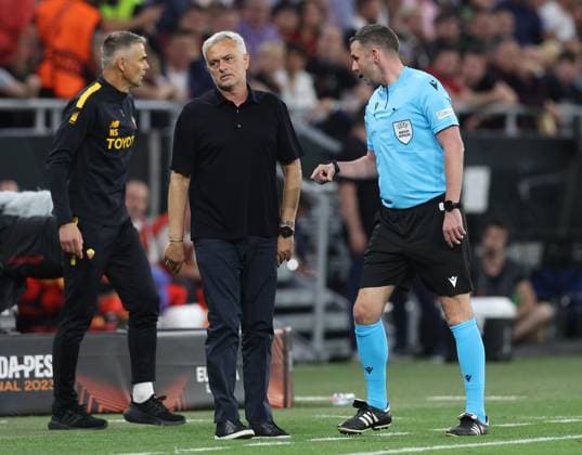 Budapest, Hungary, 31st May 2023. Assistant referee Michael Oliver tells Jose Mourinho Manager of AS Roma to move away during the UEFA Europa League Final match at Puskas Arena, Budapest. Picture credit should read: David Klein Sportimage EDITORIAL USE ONLY. No use with unauthorised audio, video, data, fixture lists, club league logos or live services. Online in-match use limited to 120 images, no video emulation. No use in betting, games or single club league player publications. SPI-2471-0104