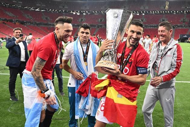 BUDAPEST, HUNGARY - MAY 31: Jesus Navas with Lucas Ocampos of Sevilla FC celebrate with the trophy during the UEFA Europa League 2022 23 final match between Sevilla FC and AS Roma at Puskas Arena on May 31, 2023 in Budapest, H Sevilla FC v AS Roma - UEFA Europa League Final 2022 23 Copyright: xSebastianxFrejx