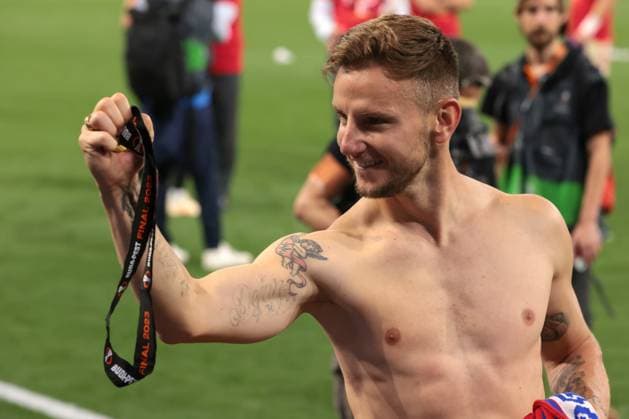 Budapest, Hungary, 31st May 2023. Ivan Rakitic of Sevilla celebrates with his winners™ medal following the penalty shoot out victory in the UEFA Europa League match at Puskas Arena, Budapest. Picture credit should read: Jonathan Moscrop Sportimage EDITORIAL USE ONLY. No use with unauthorised audio, video, data, fixture lists, club league logos or live services. Online in-match use limited to 120 images, no video emulation. No use in betting, games or single club league player publications. SPI-2476-0041