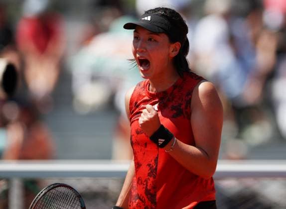 (230601) -- PARIS, June 1, 2023 -- Wang Xinyu of China celebrates during the women s singles second round match against Rebecca Peterson of Sweden at the French Open tennis tournament at Roland Garros in Paris, France, June 1, 2023. ) (SP)FRANCE-PARIS-TENNIS-ROLAND GARROS-FRENCH OPEN-WOMEN S SINGLES GaoxJing 