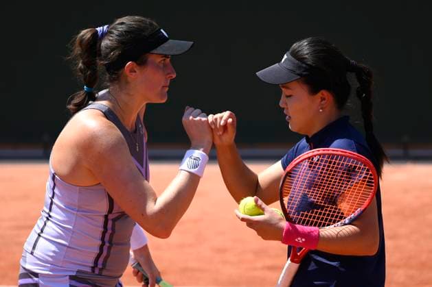 (230602) -- PARIS, June 2, 2023 -- Zhu Lin of China (R) Rebecca Marino of Canada compete during the women s doubles first round match between Xu Yifan Yang Zhaoxuan of China and Zhu Lin of China Rebecca Marino of Canada at the French Open tennis tournament at Roland Garros in Paris, France, on June 1, 2023. (Photo by Xinhua) (SP)FRANCE-PARIS-TENNIS-ROLAND GARROS-FRENCH OPEN JulienxMattia 