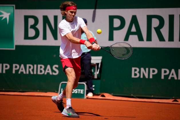 PARIS, FRANCE - JUNE 2: Andrey Rublev plays a backhand during the 3nd round of the of Roland-Garros 2023, Grand Slam tennis tournament on June 02, 2023, at Roland Garros Stadium in Paris, France. (Photo by Glenn Gervot Icon Sportswire) TENNIS: JUN 02 French Open EDITORIAL USE ONLY Icon20230602086320232
