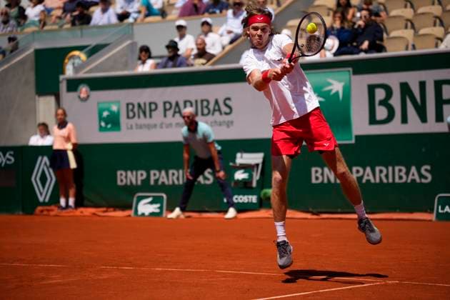 PARIS, FRANCE - JUNE 2: Andrey Rublev plays a backhand during the 3nd round of the of Roland-Garros 2023, Grand Slam tennis tournament on June 02, 2023, at Roland Garros Stadium in Paris, France. (Photo by Glenn Gervot Icon Sportswire) TENNIS: JUN 02 French Open EDITORIAL USE ONLY Icon20230602123920232