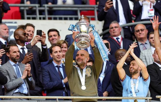 Manchester City v Manchester United, ManU FA Cup 03 06 2023. Cup Final Pep Guardiola Manager of Manchester City lifts the trophy during the FA Cup Final match between Manchester City and Manchester United at Wembley Stadium, London, England on 3 June 2023. Editorial use only DataCo restrictions apply See www.football-dataco.com , Copyright: xNigelxKeenex PSI-17505-0072