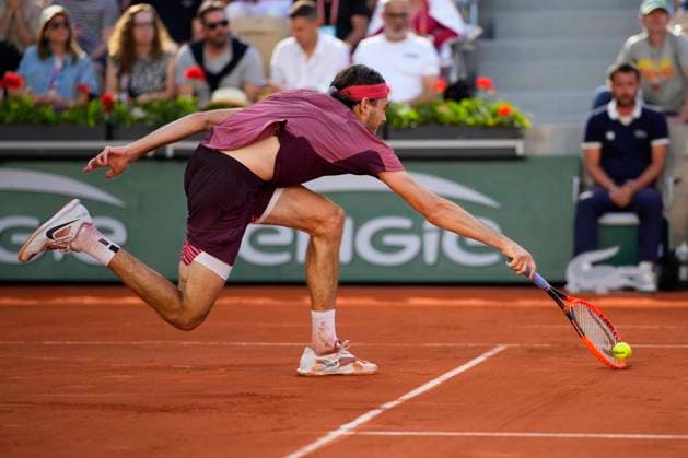 PARIS, FRANCE - JUNE 3: Taylor Fritz makes an acrobatic save at the net during the 3nd round of Roland Garros 2023 match at Roland Garros Stadium on June 3, 2023 in Paris, France. (Photo by Glenn Gervot Icon Sportswire) TENNIS: JUN 03 French Open EDITORIAL USE ONLY Icon2306034611