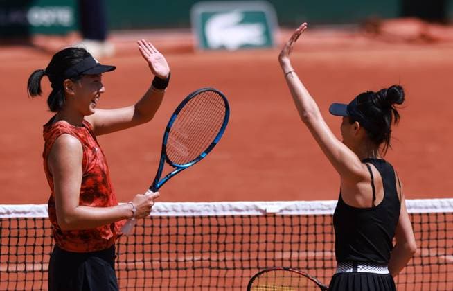 (230604) -- PARIS, June 4, 2023 -- Wang Xinyu (L) of China Hsieh Su-Wei of Chinese Taipei celebrate winning the women s doubles second round match against Zhang Shuai of China Kristina Mladenovic of France at the French Open tennis tournament at Roland Garros in Paris, France, June 4, 2023. ) (SP)FRANCE-PARIS-TENNIS-ROLAND GARROS-FRENCH OPEN-WOMEN S DOUBLES GaoxJing 