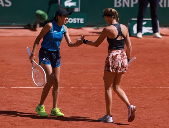 (230604) -- PARIS, June 4, 2023 -- Zhang Shuai (L) of China Kristina Mladenovic of France react during the women s doubles second round match against Wang Xinyu of China Hsieh Su-Wei of Chinese Taipei at the French Open tennis tournament at Roland Garros in Paris, France, June 4, 2023. ) (SP)FRANCE-PARIS-TENNIS-ROLAND GARROS-FRENCH OPEN-WOMEN S DOUBLES GaoxJing 