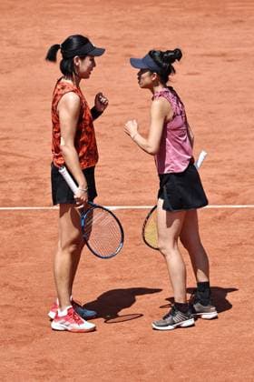Wang Xinyu red , CHN, and Hsieh Su Wei pink , TPE, during womens doubles at 2023 French Open at Roland Garros, Paris, 05 06 2023