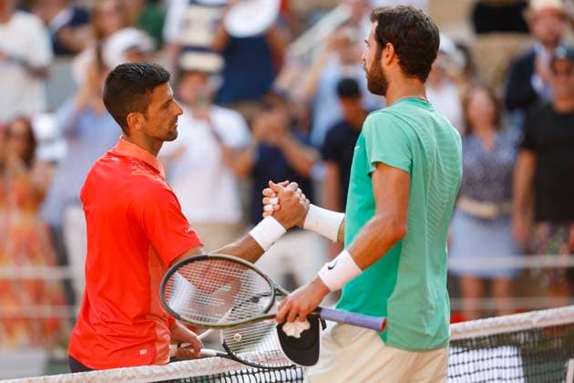 Karen Khachanov congratulates the winner Novak Djokovic SRB Copyright: xJuergenxHasenkopfx