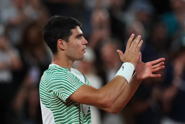 (230607) -- PARIS, June 7, 2023 -- Carlos Alcaraz celebrates after winning the men s singles quarterfinal match between Carlos Alcaraz of Spain and Stefanos Tsitsipas of Greece at the French Open tennis tournament at Roland Garros in Paris, France, on June 6, 2023. ) (SP)FRANCE-PARIS-TENNIS-ROLAND GARROS-FRENCH OPEN-MEN S SINGLES GaoxJing 