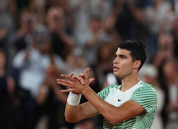 (230607) -- PARIS, June 7, 2023 -- Carlos Alcaraz celebrates after winning the men s singles quarterfinal match between Carlos Alcaraz of Spain and Stefanos Tsitsipas of Greece at the French Open tennis tournament at Roland Garros in Paris, France, on June 6, 2023. ) (SP)FRANCE-PARIS-TENNIS-ROLAND GARROS-FRENCH OPEN-MEN S SINGLES GaoxJing 