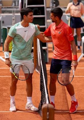 Mandatory Credit: Photo by Ella Ling Shutterstock (13949275a) Carlos Alcaraz of Spain stands with Novak Djokovic at the net before their match French Open Tennis, Day 13, Roland Garros, Paris, France - 09 June 2023 French Open Tennis, Day 13, Roland Garros, Paris, France - 09 June 2023  Copyright: xEllaxLing Shutterstockx 13949275a
