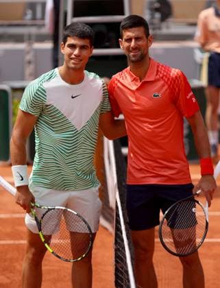 Mandatory Credit: Photo by Ella Ling Shutterstock (13949275b) Carlos Alcaraz of Spain stands with Novak Djokovic at the net before their match French Open Tennis, Day 13, Roland Garros, Paris, France - 09 June 2023 French Open Tennis, Day 13, Roland Garros, Paris, France - 09 June 2023  Copyright: xEllaxLing Shutterstockx 13949275b