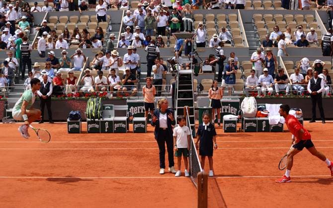 Mandatory Credit: Photo by Ella Ling Shutterstock (13949275c) Carlos Alcaraz of Spain jumps opposite Novak Djokovic at the net before their match French Open Tennis, Day 13, Roland Garros, Paris, France - 09 June 2023 French Open Tennis, Day 13, Roland Garros, Paris, France - 09 June 2023  Copyright: xEllaxLing Shutterstockx 13949275c