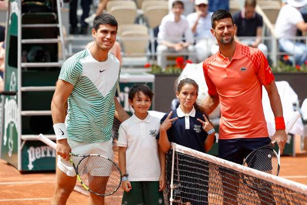 Carlos Alcaraz and Novak Djokovic pose at the net for the photographers, mens singles semifinals Copyright: xJuergenxHasenkopfx