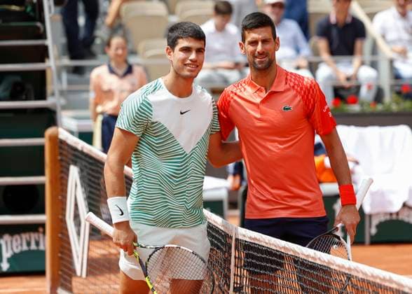 Carlos Alcaraz and Novak Djokovic pose at the net for the photographers, mens singles semifinals Copyright: xJuergenxHasenkopfx