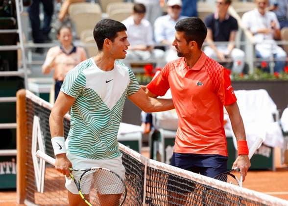 Carlos Alcaraz and Novak Djokovic pose at the net for the photographers, mens singles semifinals Copyright: xJuergenxHasenkopfx